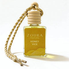 Zoura Parfums Honey Vice perfume bottle with wooden cap on a white background