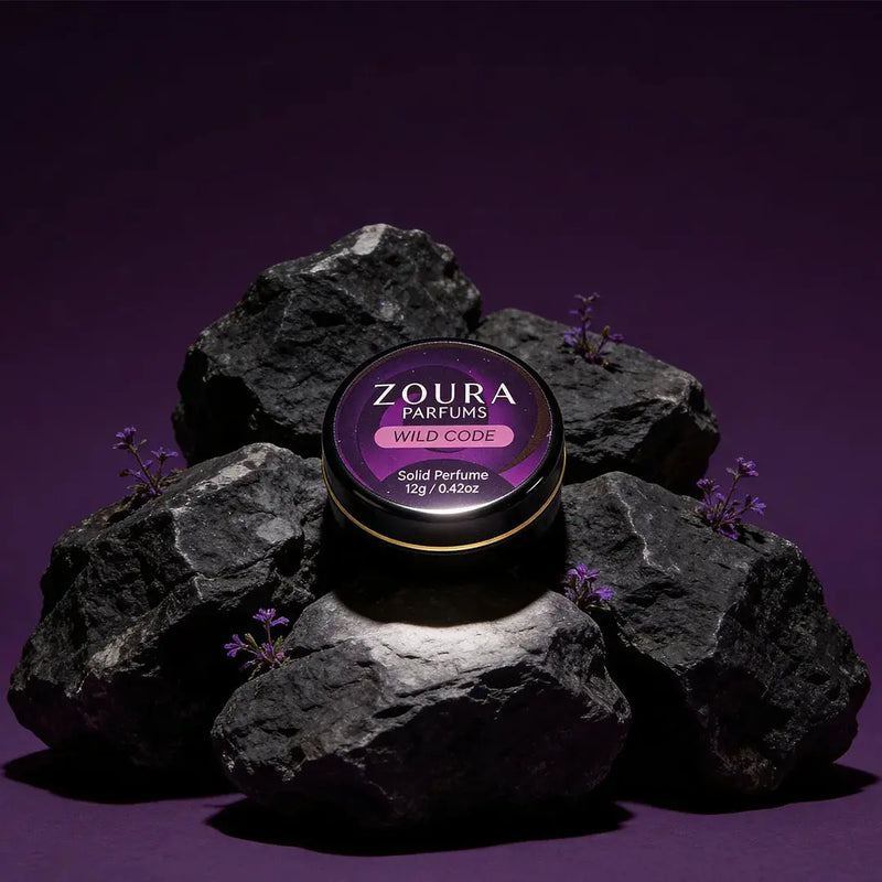 Zoura Wild Code Solid Perfume jar on purple rocks