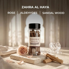 Zoura Zahra Al Haya bakhoor sticks jar with rose, aldehydes, and sandalwood notes styled with a pink rose and sandalwood