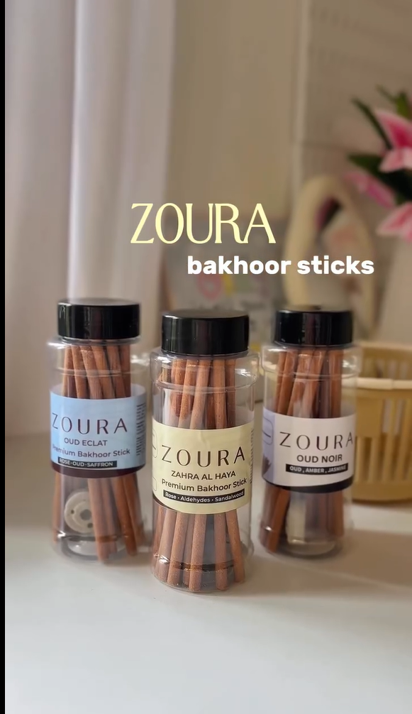 Zoura Parfums premium bakhoor sticks, three jars — Oud Eclat, Zahra Al Haya and Oud Noir — displayed in a basket, non-alcoholic Arabic-inspired incense sticks.