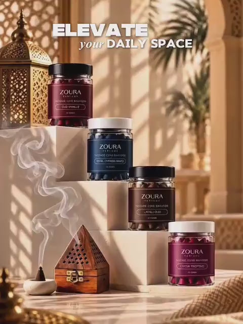 Zoura Parfums bakhoor incense cones displayed on elegant steps with aromatic smoke in a warm luxury setting.