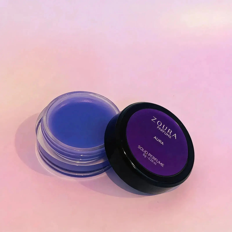Aura Solid Unisex Perfume open jar showing blue-purple balm texture by Zoura Parfums