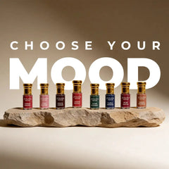 Zoura Parfums "Choose Your Mood" attar collection lineup including Anjeer Royale on a stone display