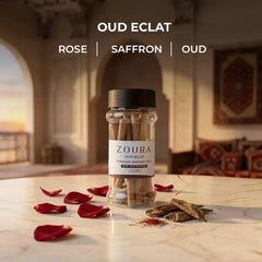 Zoura Oud Eclat bakhoor sticks jar with rose, saffron, and oud notes styled with red rose petals and oud wood