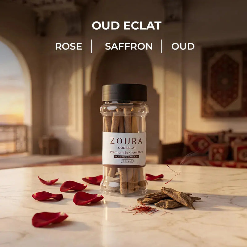Zoura Oud Eclat bakhoor sticks jar with rose, saffron, and oud notes styled with red rose petals and oud wood
