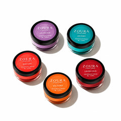 Zoura Parfums deodorant cream collection of five 8g jars in purple, teal, red, orange and crimson, scents Lavish Oud, Victory and Sun Kiss